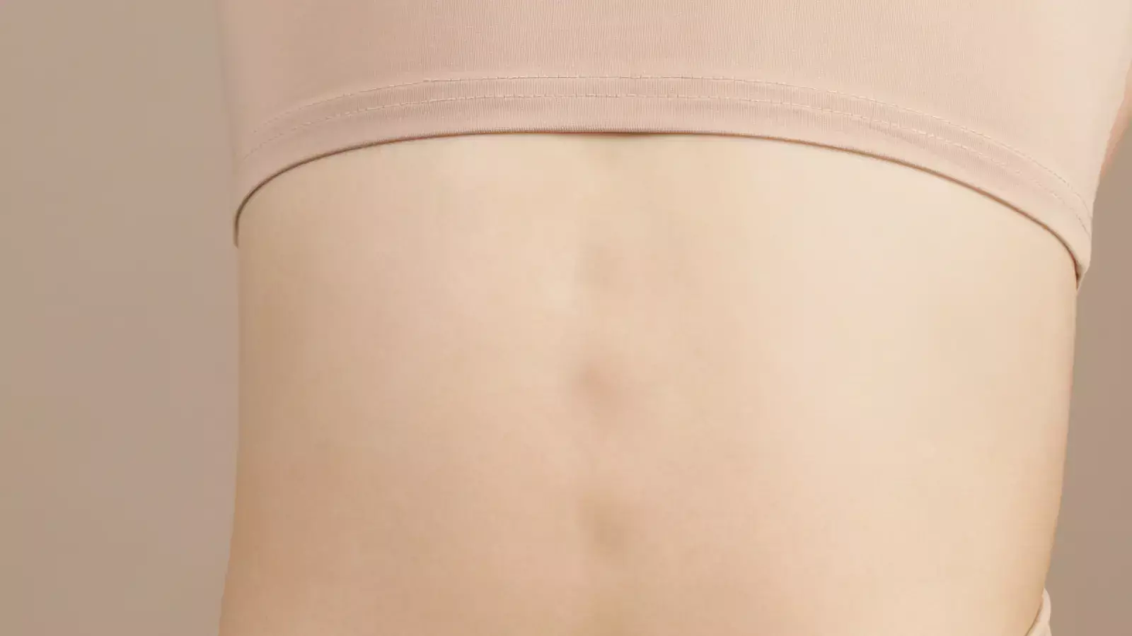 Close-up of a woman’s lower back and spine