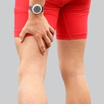 Sports Man Experiencing Thigh Tendon Pain After Running
